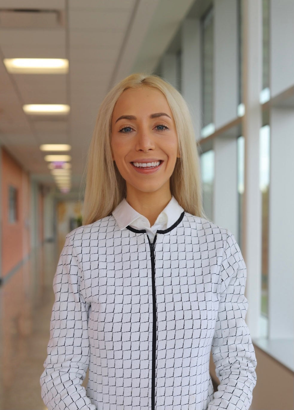 UIC RN to BSN alumna Isabelle Walker smiles in business formal attire.